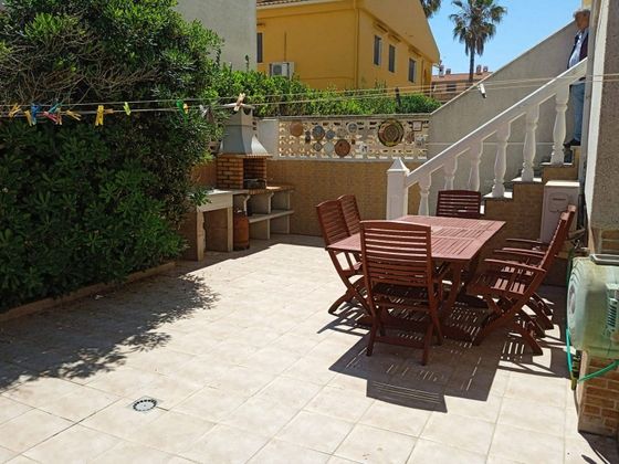 Foto 1 de Casa adossada en venda a El Perelló - Les Palmeres - Mareny de Barraquetes de 4 habitacions amb terrassa i garatge