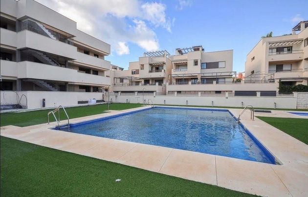 Foto 1 de Piso en venta en Benajarafe – Almayate de 2 habitaciones con terraza y piscina