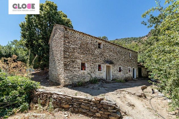 Foto 1 de Casa rural en venta en Guejar Sierra de 4 habitaciones con jardín