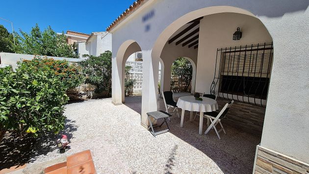 Foto 1 de Chalet en venta en Oliva Playa de 5 habitaciones con terraza y garaje