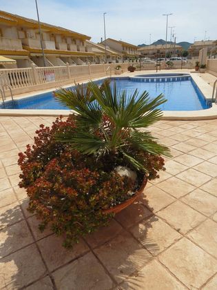 Foto 2 de Casa adossada en venda a calle Magón de 2 habitacions amb terrassa i piscina