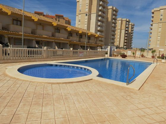 Foto 1 de Casa adossada en venda a calle Magón de 2 habitacions amb terrassa i piscina