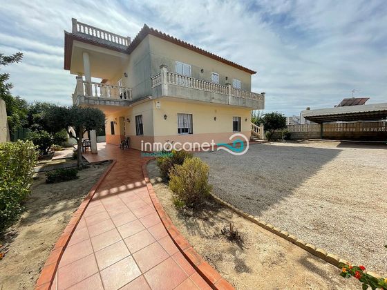 Foto 1 de Casa en venta en Oliva Playa de 5 habitaciones con terraza y aire acondicionado
