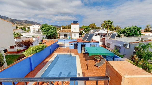 Foto 1 de Venta de chalet en Churriana de 5 habitaciones con terraza y piscina