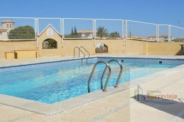 Foto 1 de Dúplex en venta en Playa Flamenca - Punta Prima de 3 habitaciones con terraza y piscina