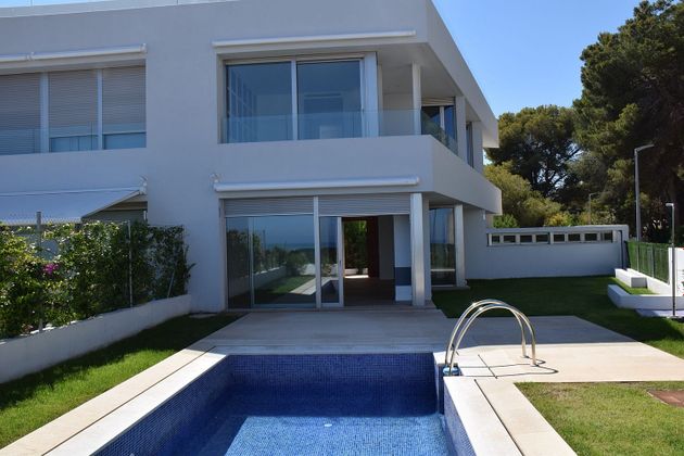 Foto 1 de Casa adosada en venta en calle Del Camí de L'atall de 3 habitaciones con terraza y piscina