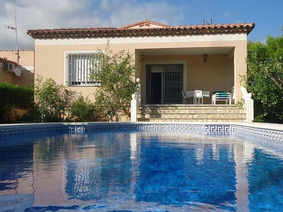 Foto 1 de Casa adosada en venta en Les Tres Cales de 4 habitaciones con piscina y garaje