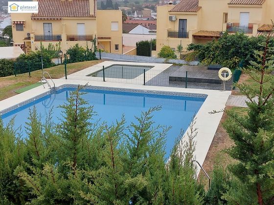 Foto 1 de Venta de casa adosada en Ronquillo (El) de 3 habitaciones con terraza y piscina