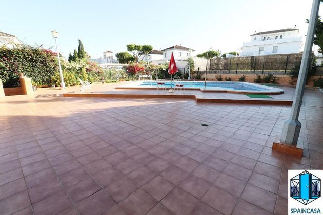 Foto 1 de Venta de chalet en Cartaya de 5 habitaciones con terraza y piscina