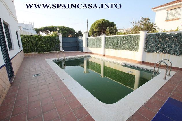 Foto 1 de Casa en venda a Cartaya de 5 habitacions amb piscina i garatge