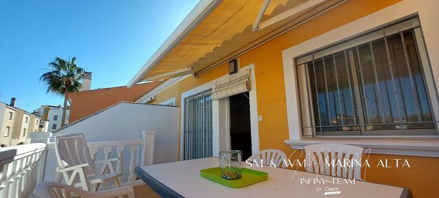 Foto 2 de Venta de casa adosada en Oliva Nova de 4 habitaciones con terraza y piscina