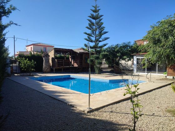 Foto 1 de Chalet en venta en Les Tres Cales de 5 habitaciones con terraza y piscina