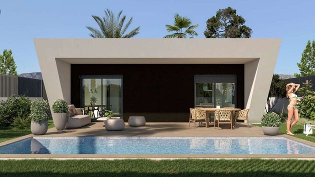 Foto 2 de Venta de casa en Monforte del Cid de 3 habitaciones con piscina y jardín