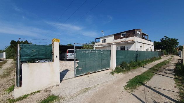 Foto 1 de Casa en venta en Oliva Playa de 3 habitaciones con terraza y jardín