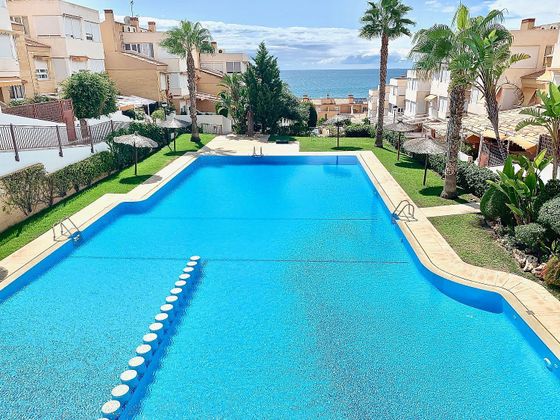 Foto 1 de Casa adosada en venta en Cabo de las Huertas de 4 habitaciones con terraza y piscina