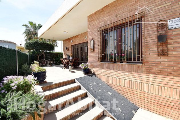 Foto 1 de Chalet en venta en Oliva Playa de 3 habitaciones con terraza y aire acondicionado