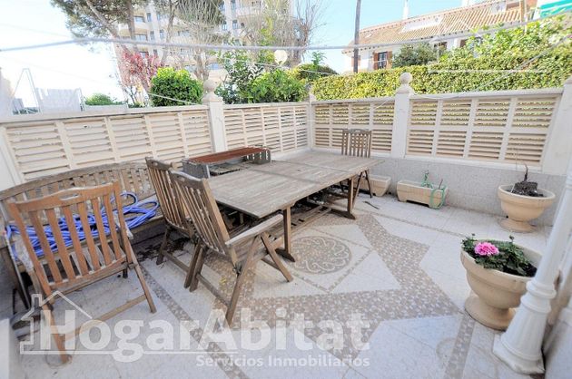 Foto 1 de Casa en venda a Playa del Puig de 4 habitacions amb terrassa i piscina