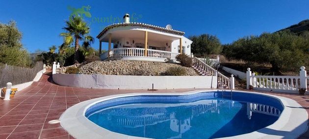 Foto 1 de Casa en venda a Viñuela de 3 habitacions amb terrassa i piscina