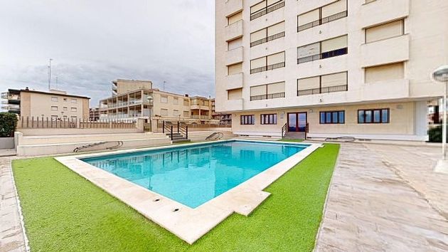 Foto 1 de Pis en venda a El Perelló - Les Palmeres - Mareny de Barraquetes de 4 habitacions amb terrassa i piscina
