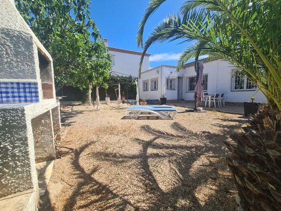 Foto 1 de Chalet en venta en Miami Platja - Miami Playa de 4 habitaciones con terraza y piscina