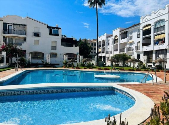 Foto 1 de Piso en venta en Playa de Granada de 2 habitaciones con piscina y aire acondicionado