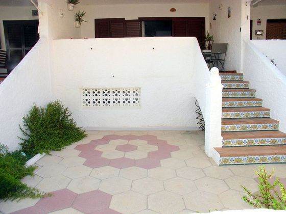 Foto 1 de Venta de casa adosada en El Perelló - Les Palmeres - Mareny de Barraquetes de 4 habitaciones con terraza y aire acondicionado