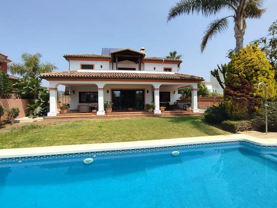 Foto 1 de Chalet en venta en Nueva Alcántara de 5 habitaciones con terraza y piscina