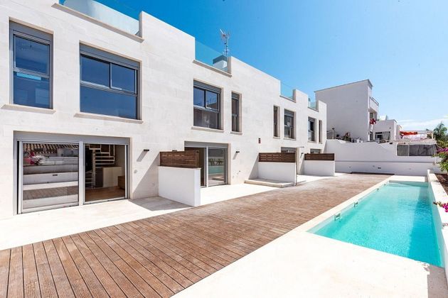 Foto 1 de Venta de casa adosada en El Molinar - Can Pere Antoni de 3 habitaciones con terraza y piscina