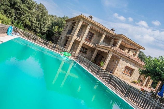 Foto 1 de Chalet en venta en Serinyà de 5 habitaciones con terraza y piscina