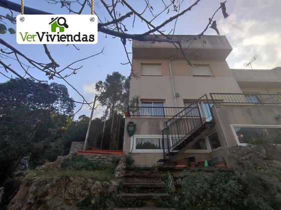 Foto 1 de Casa adosada en venta en Vallirana de 4 habitaciones con terraza y garaje
