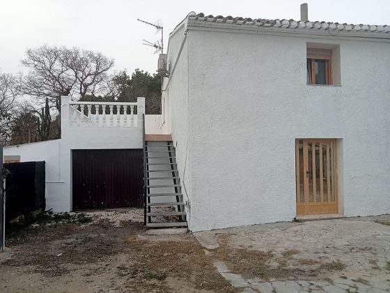 Foto 1 de Venta de casa en Oliva Nova de 5 habitaciones con terraza y aire acondicionado