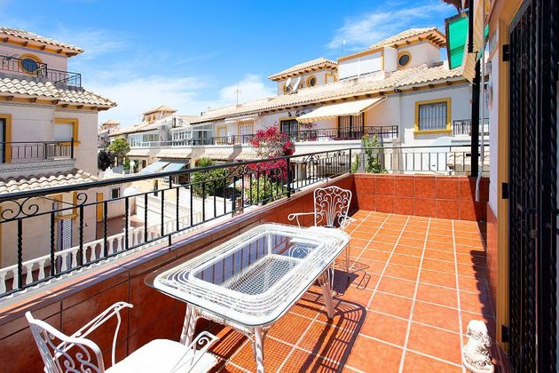 Foto 1 de Casa adossada en venda a Playa Flamenca - Punta Prima de 2 habitacions amb terrassa i piscina