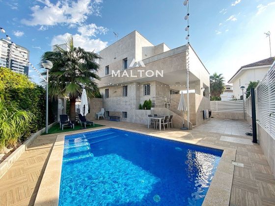 Foto 2 de Venta de chalet en Playa del Puig de 4 habitaciones con terraza y piscina