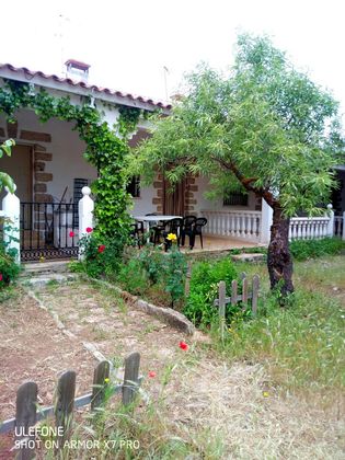 Foto 1 de Venta de casa adosada en calle Escudero Guadiana de 1 habitación con terraza y jardín