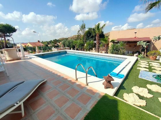 Foto 1 de Chalet en venta en Moralet - Cañada del Fenollar de 5 habitaciones con terraza y piscina