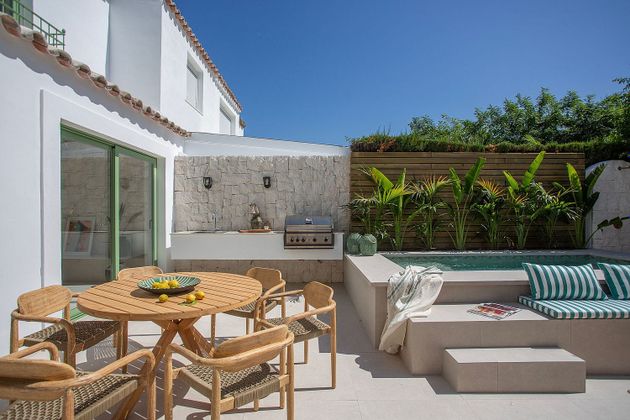 Foto 1 de Casa adossada en venda a Nueva Alcántara de 4 habitacions amb terrassa i piscina