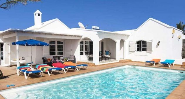 Foto 1 de Xalet en venda a Puerto del Carmen de 4 habitacions amb terrassa i piscina