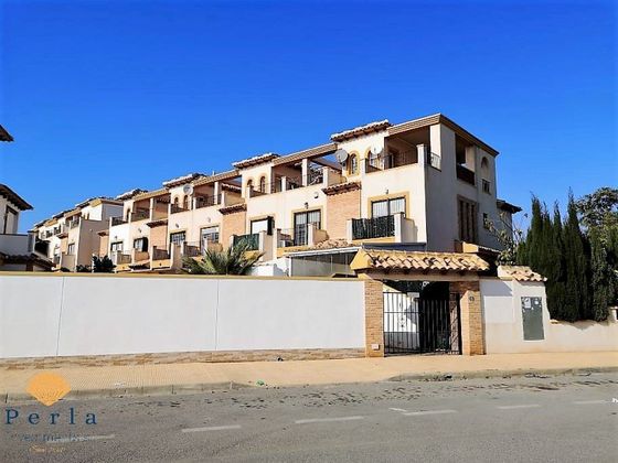 Foto 1 de Venta de casa adosada en Cabo Roig - La Zenia de 3 habitaciones con terraza y piscina
