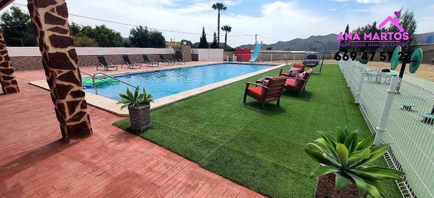 Foto 1 de Chalet en venta en Águilas ciudad de 4 habitaciones con terraza y piscina