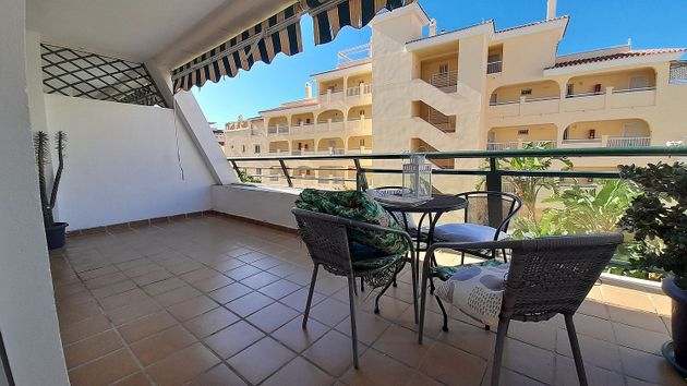 Foto 1 de Piso en venta en calle Almuñécar de 3 habitaciones con terraza y piscina
