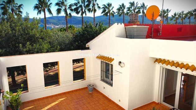 Foto 1 de Casa adossada en venda a Beniarjó de 5 habitacions amb terrassa i balcó