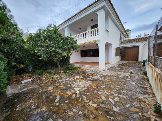 Foto 1 de Venta de casa en El Perelló - Les Palmeres - Mareny de Barraquetes de 4 habitaciones con terraza y piscina