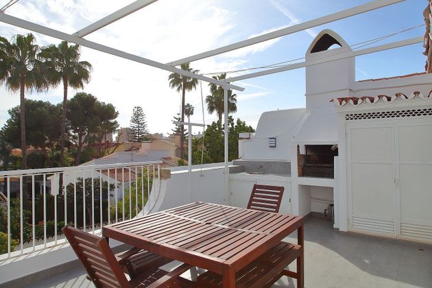 Foto 2 de Venta de casa adosada en Playamar de 4 habitaciones con terraza y piscina