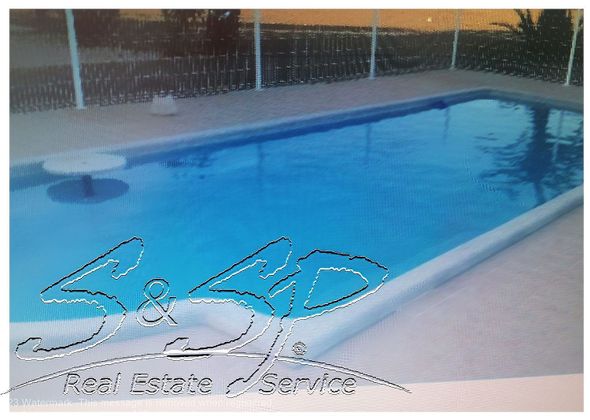 Foto 2 de Chalet en venta en Águilas ciudad de 3 habitaciones con terraza y piscina