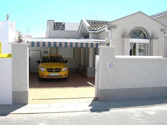 Foto 1 de Venta de casa adosada en avenida De Los Almendros Torrevieja Alicante Espa de 2 habitaciones con terraza y piscina