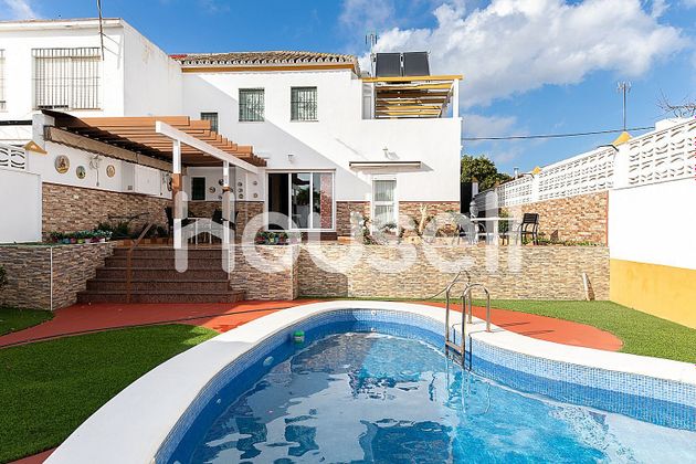 Foto 1 de Venta de casa en Castilleja de la Cuesta de 4 habitaciones con terraza y piscina