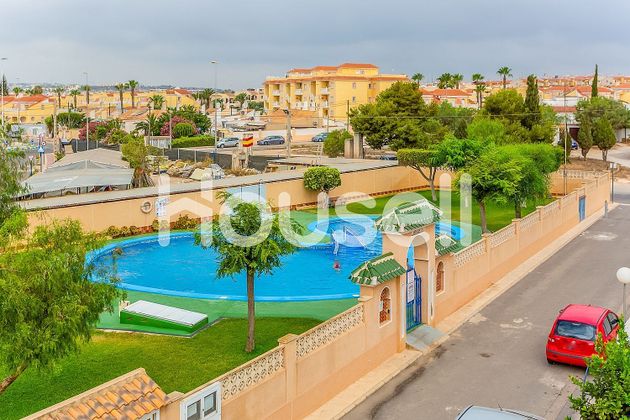 Foto 1 de Casa en venta en Playa Flamenca - Punta Prima de 3 habitaciones con terraza y piscina