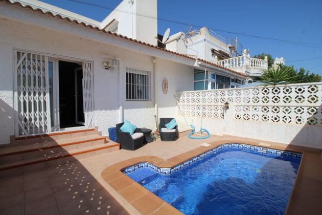 Foto 1 de Venta de casa adosada en San Miguel de Salinas de 3 habitaciones con terraza y piscina