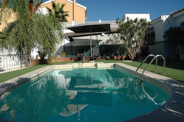 Foto 1 de Venta de chalet en Puerto de la Torre - Atabal de 4 habitaciones con piscina y garaje
