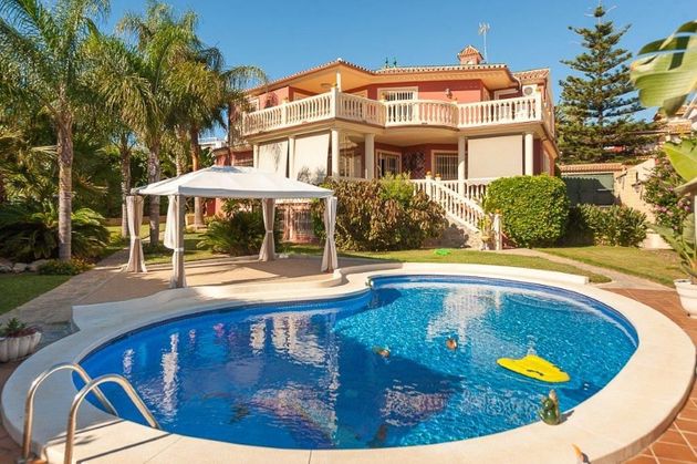 Foto 2 de Venta de chalet en Playamar de 5 habitaciones con terraza y piscina